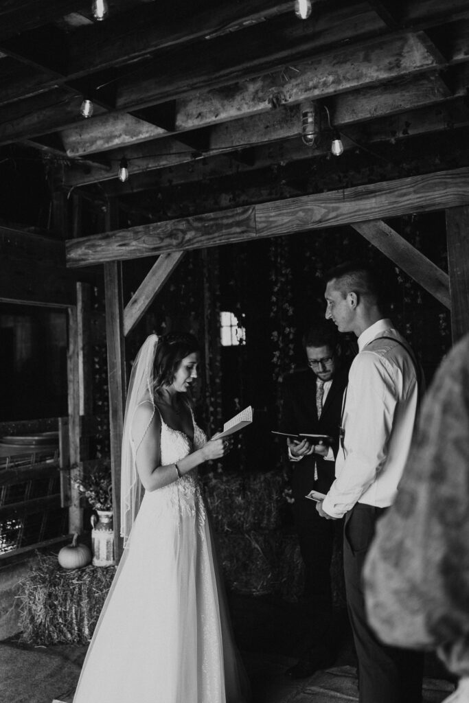 couple reads vows during intimate backyard wedding