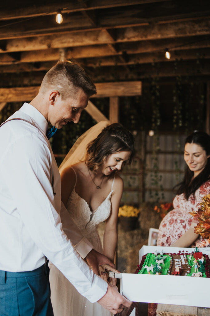 couple cutting cake together