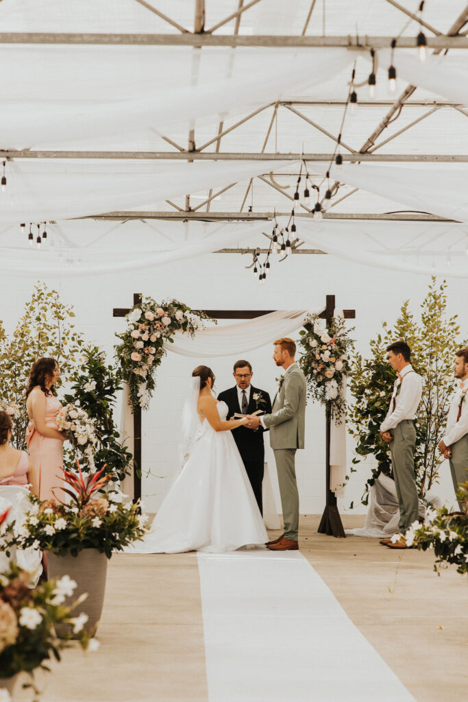 couple exchanges vows during wedding ceremony