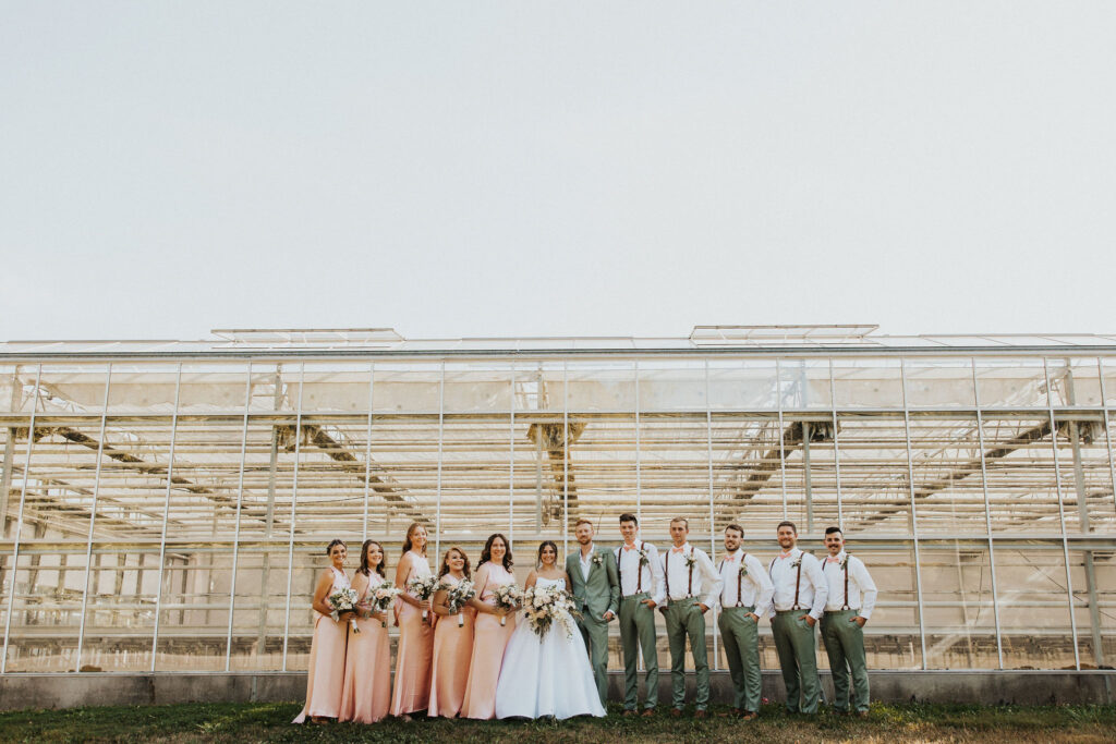 couple poses with wedding party at Central Ohio wedding venues