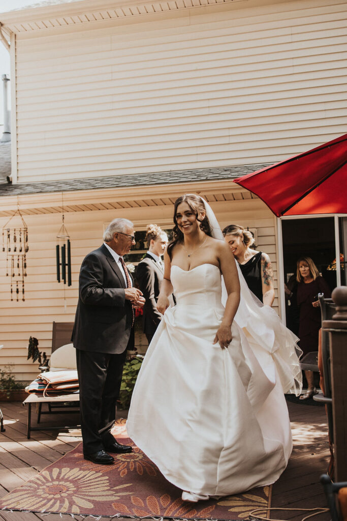 bride walks to first look