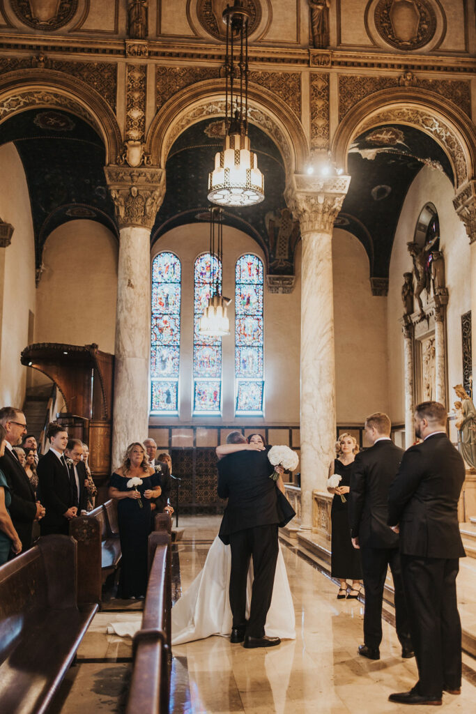 couple has wedding ceremony at Catholic church 