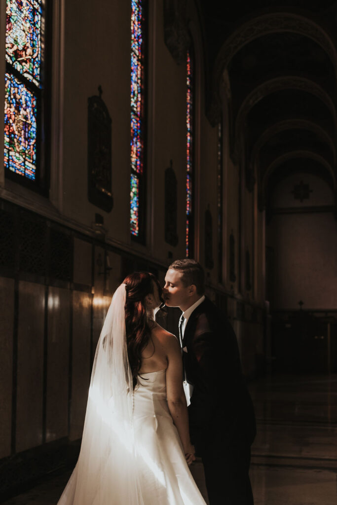 couple kisses after wedding ceremony