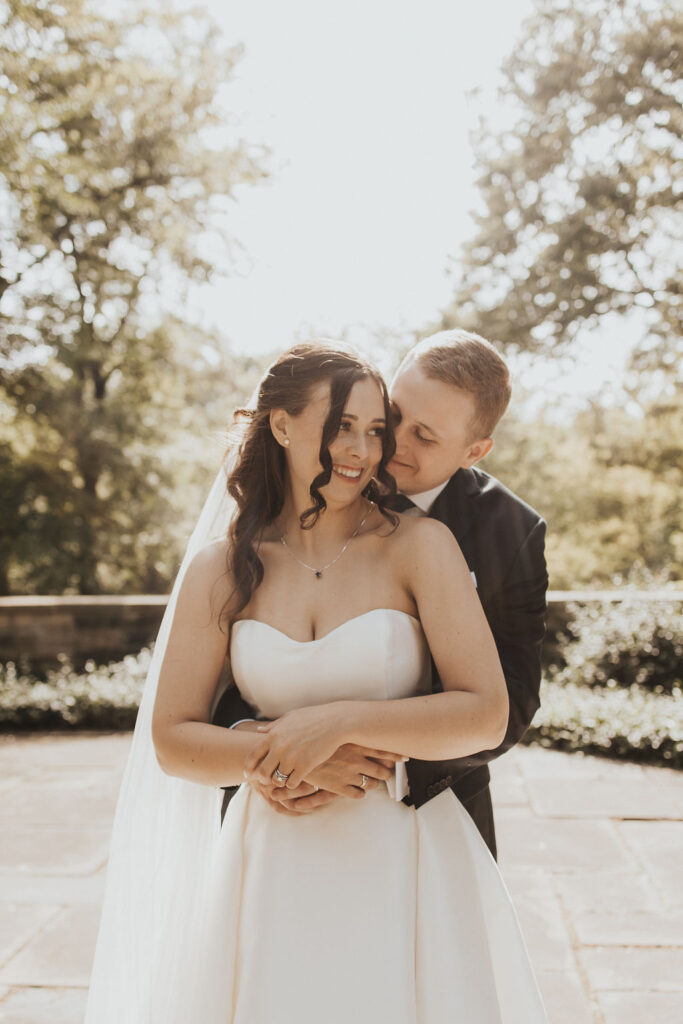 couple embraces during wedding portraits