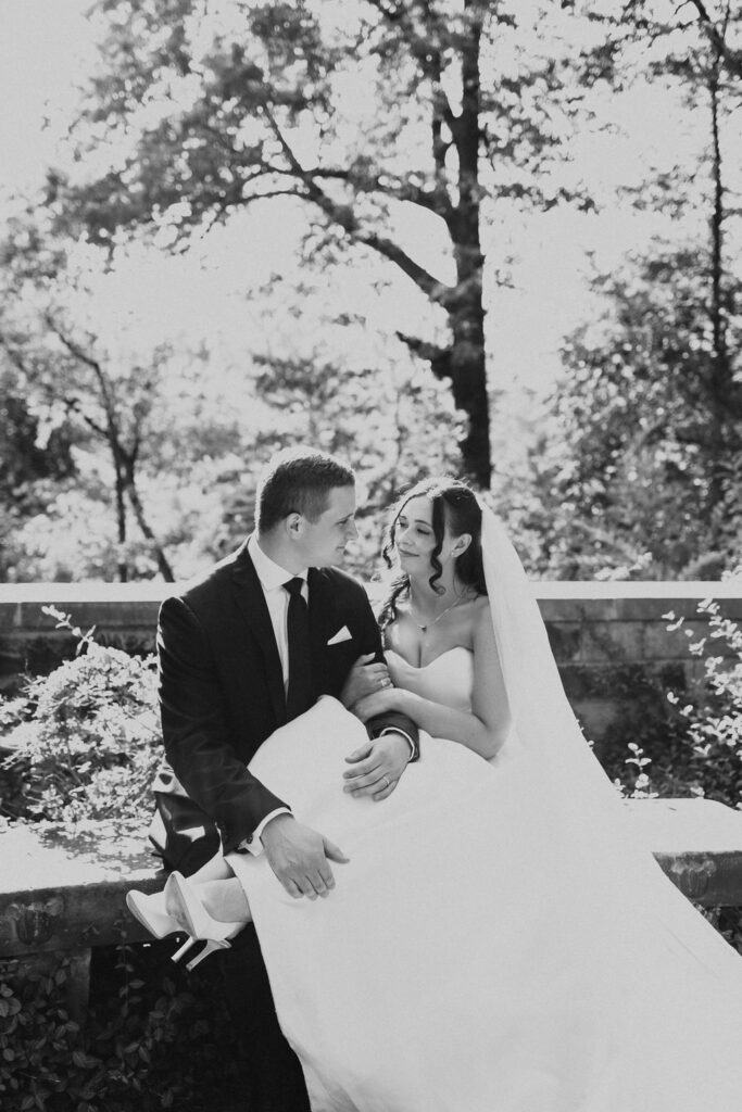 bride and groom sit together at Cleveland Cultural Gardens