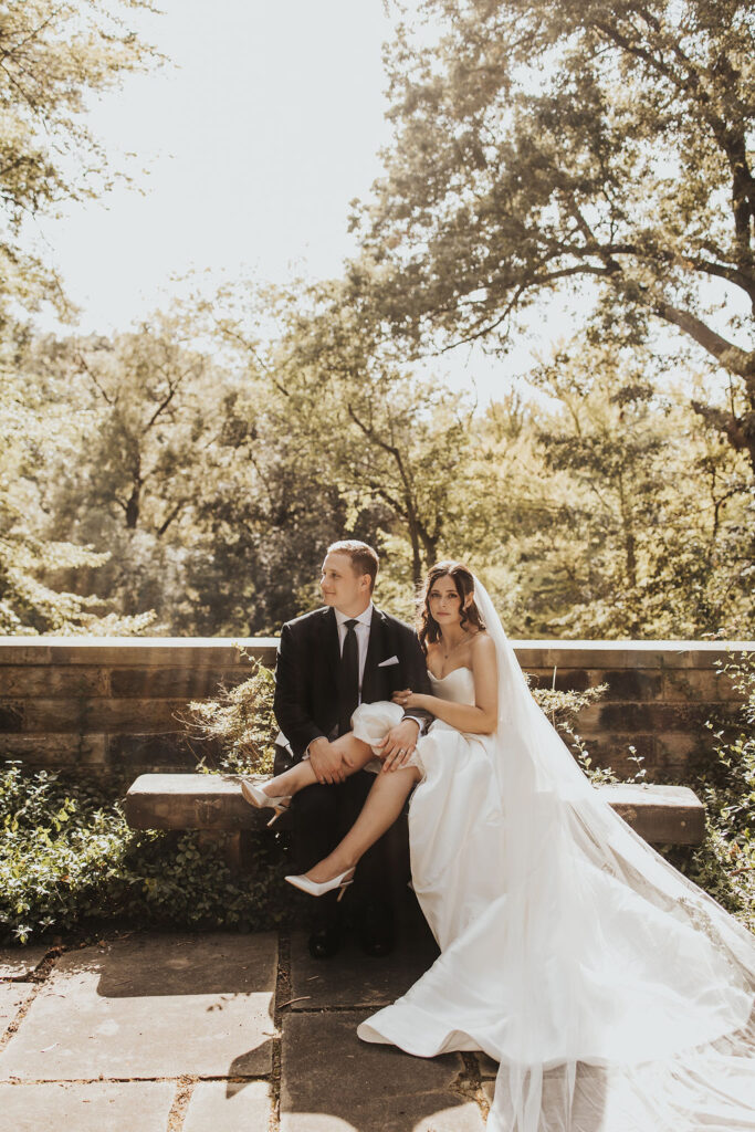 bride sits on groom's lap