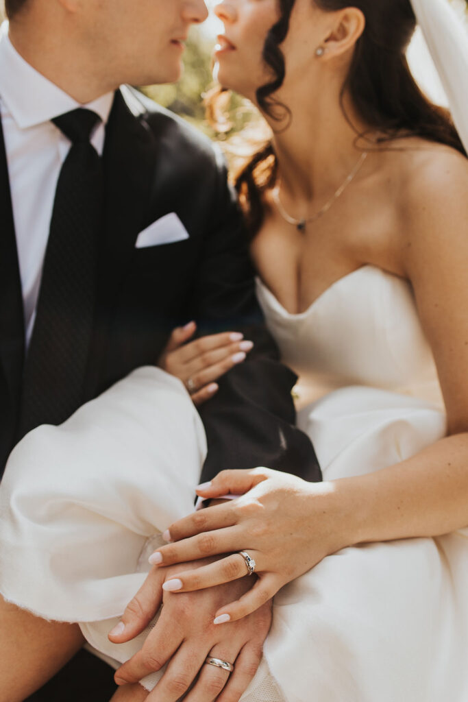 bride sits on groom's lap