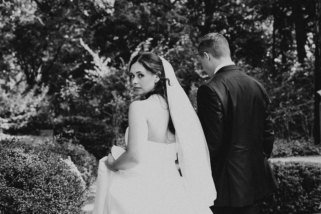 couple walks holding hands in Cleveland Cultural Gardens