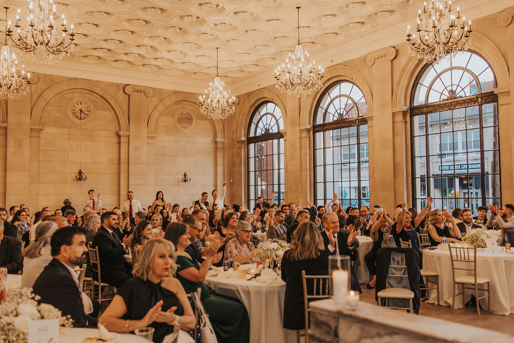 guests sit together during wedding reception