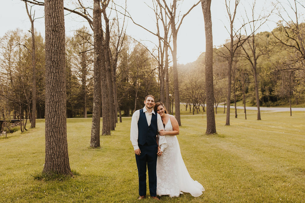 couple poses in woods at Central Ohio wedding venues