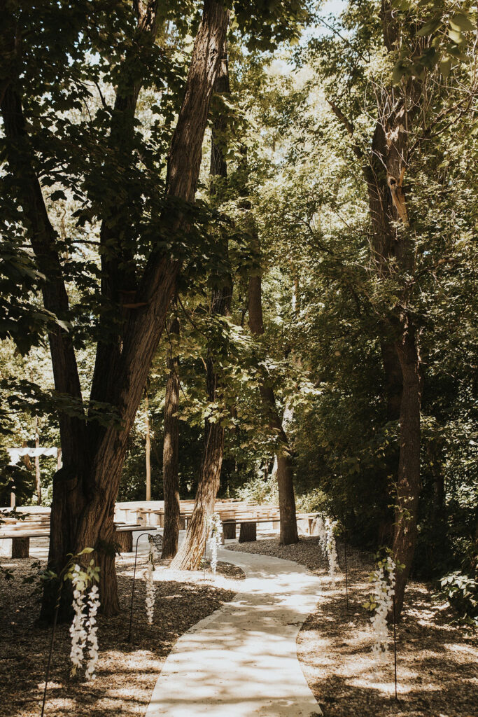 pathway through woods to wedding ceremony location