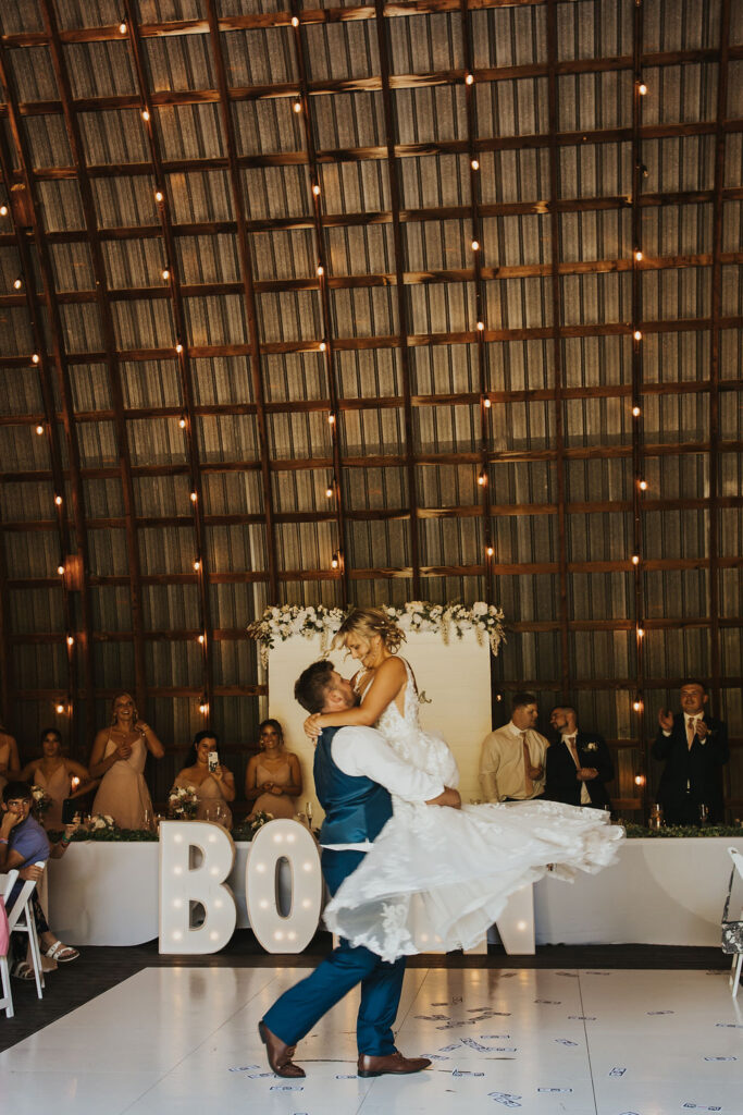 couple dance together during Harvest Moon wedding reception