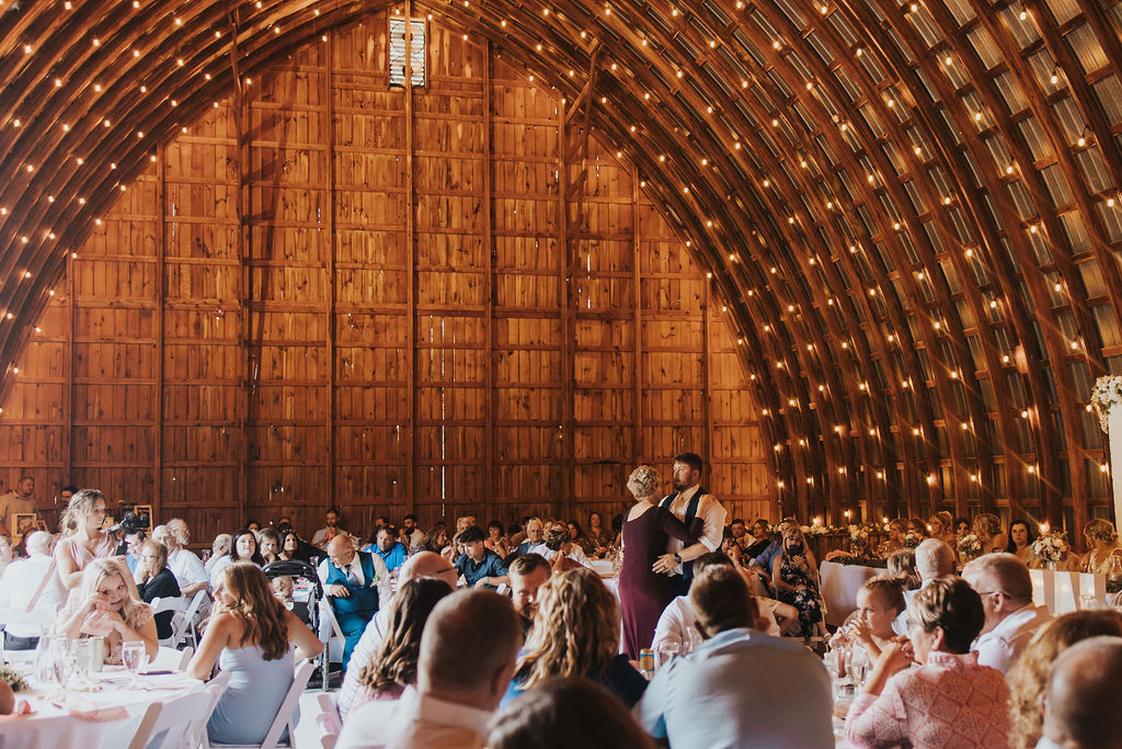 couple dance together during Harvest Moon wedding reception