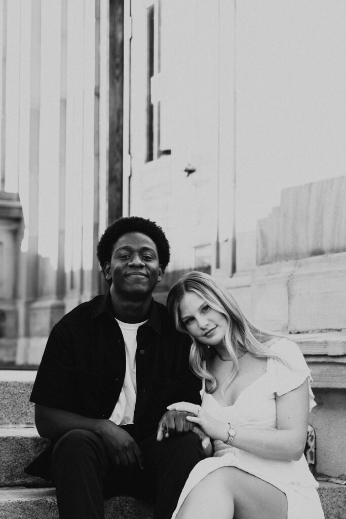 couple embraces during city engagement session