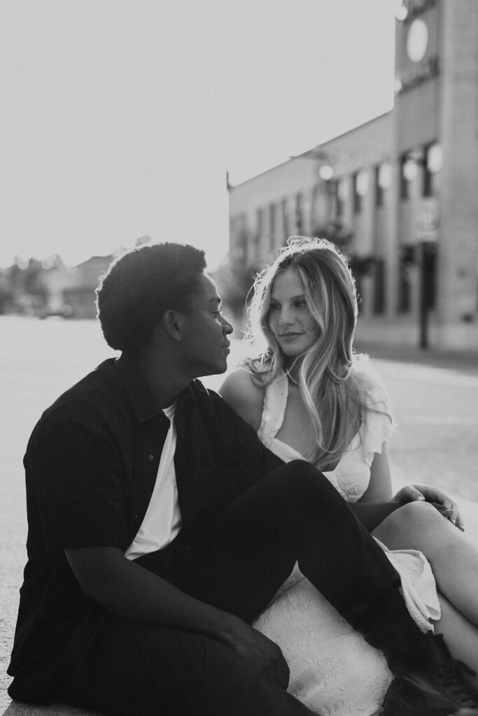 couple embraces during city engagement session