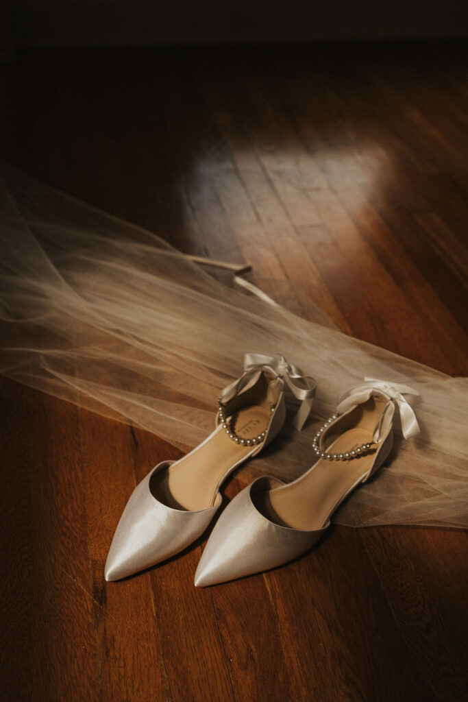 wedding shoes and veil in sunlight