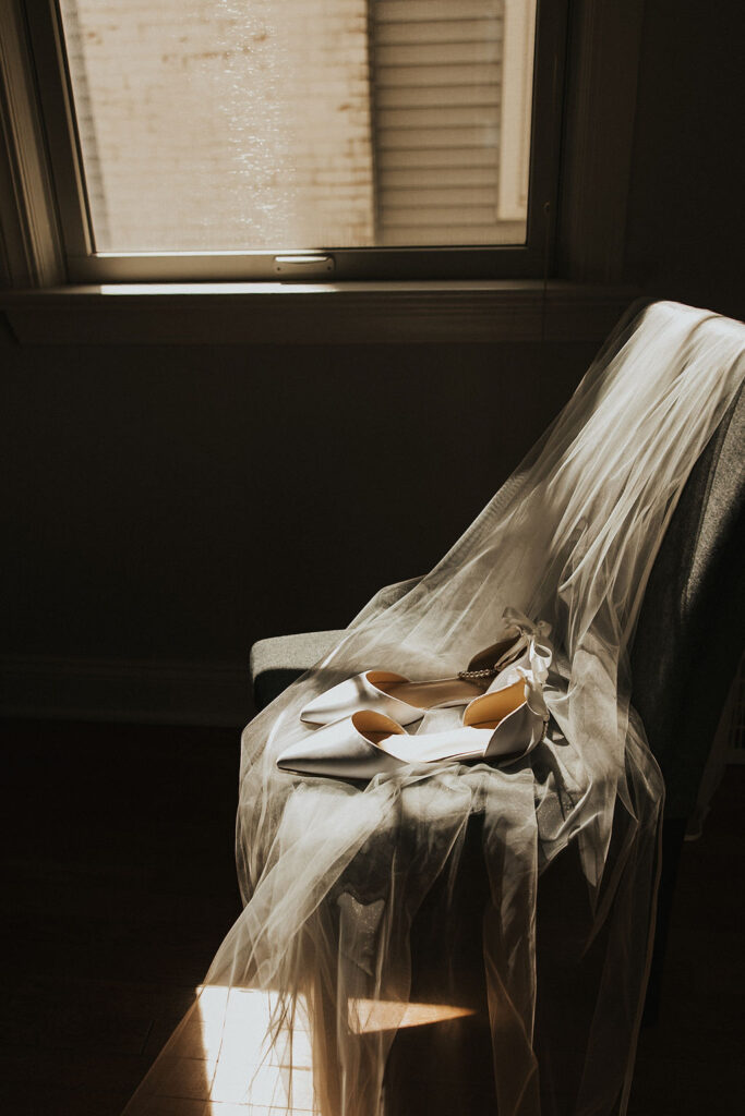 wedding shoes and veil in sunlight