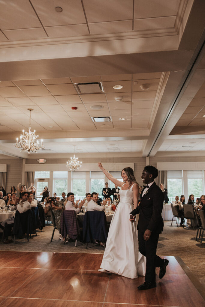 guests cheer as couple enters wedding reception at Cleveland ohio country club