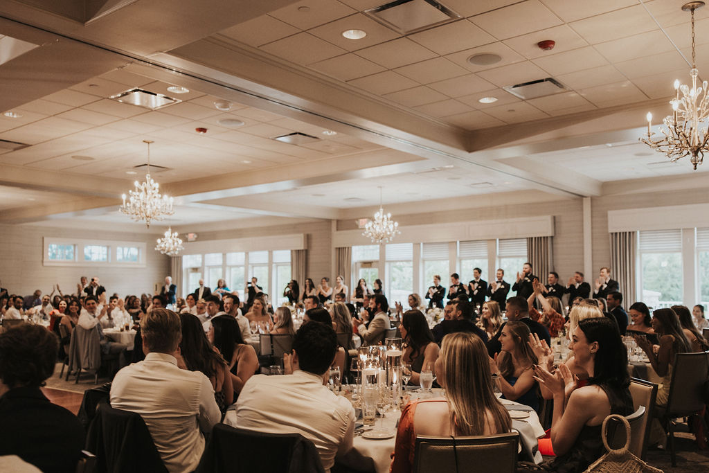 guests cheer as couple enters wedding reception at Cleveland ohio country club