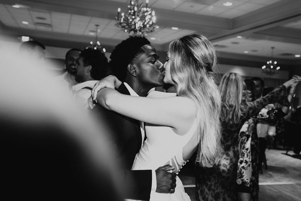 couple kisses during wedding reception dancing at Cleveland ohio country club