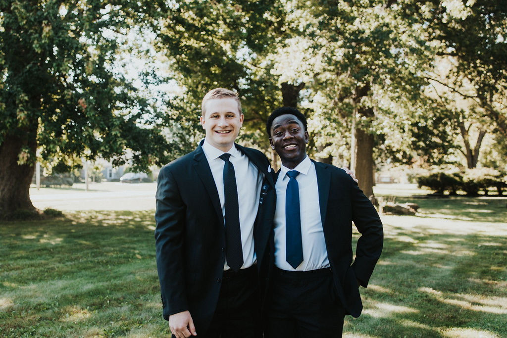 groom poses with groomsman