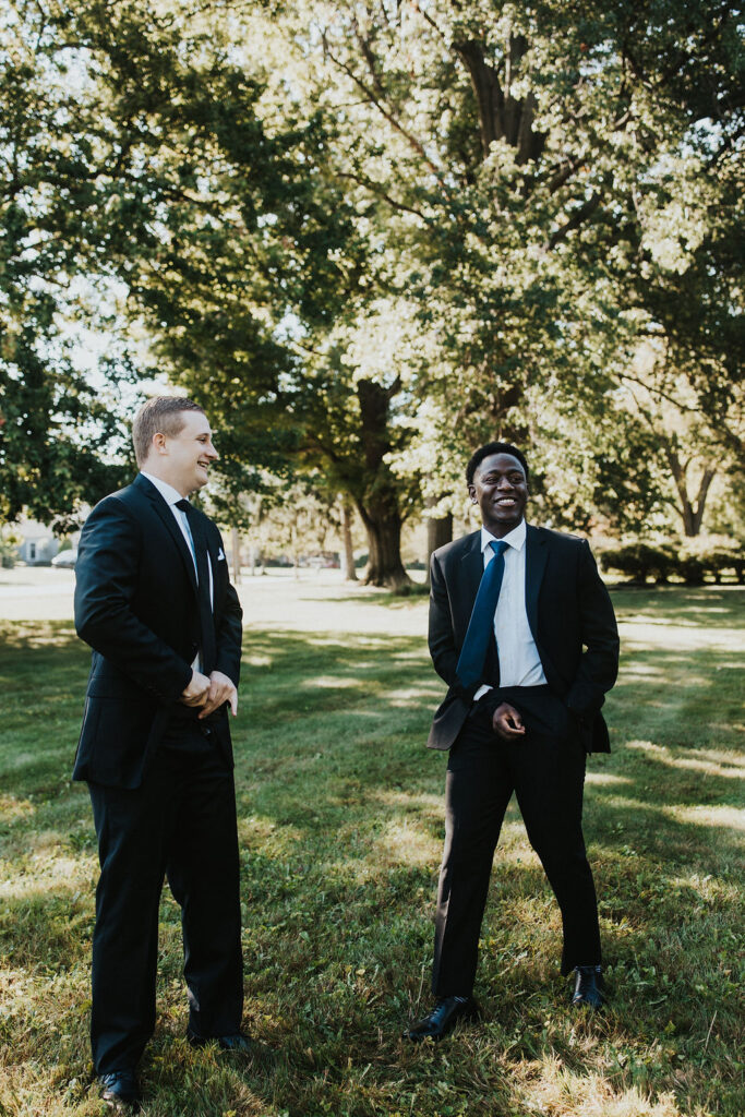 groomsmen shake hands in funny pose