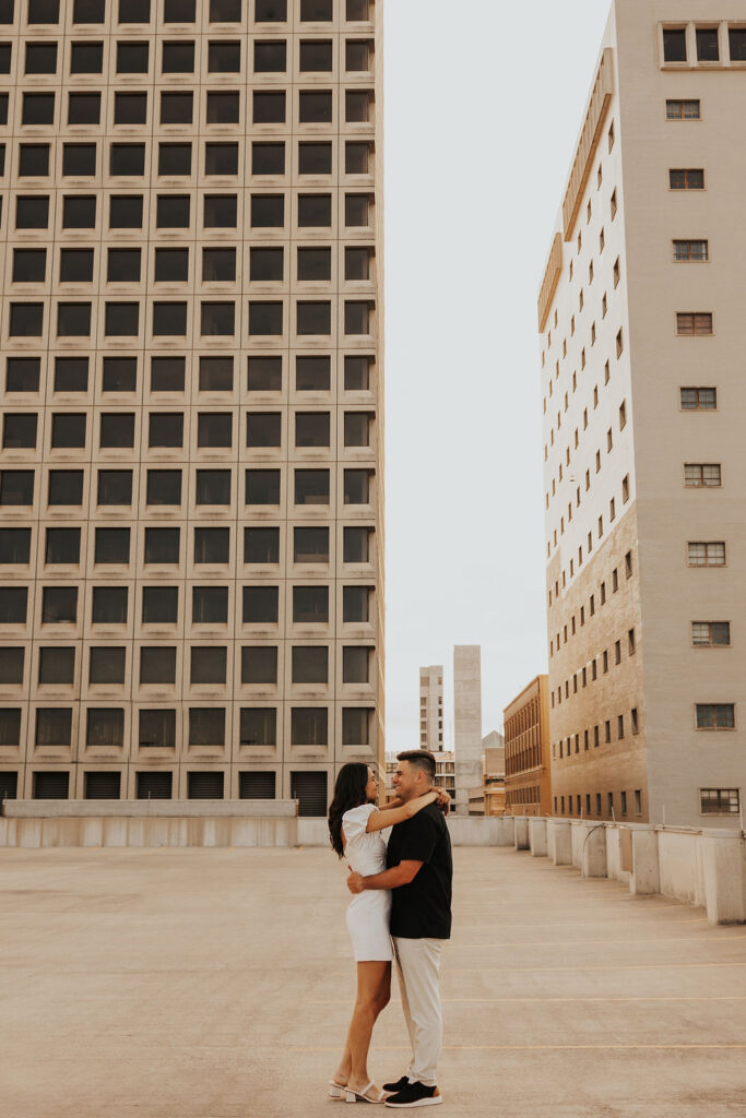 couple embrace on rooftop parking garage in downtown columbus ohio
