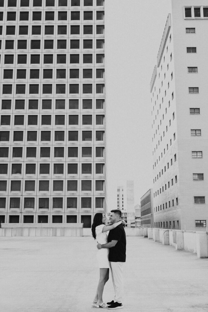 couple embrace on rooftop parking garage in downtown columbus ohio