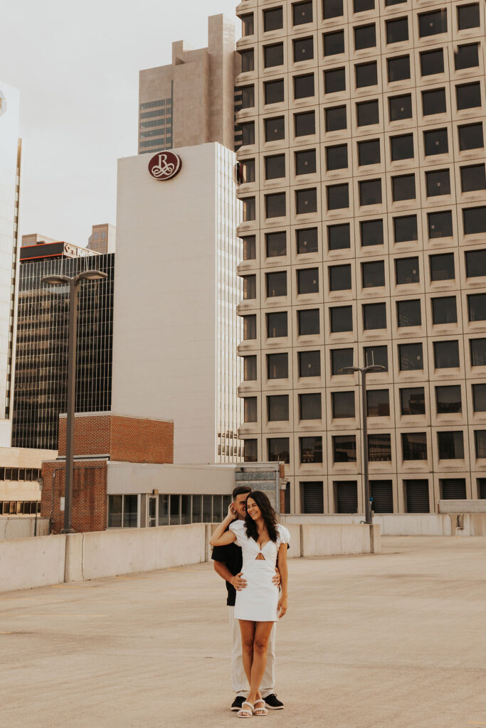 couple pose on rooftop parking garage in downtown columbus ohio
