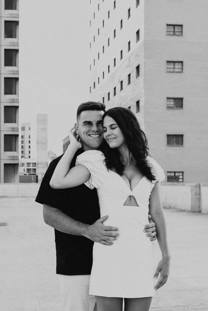 couple embrace on rooftop parking garage in downtown columbus ohio