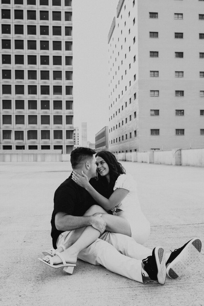 couple sit together on rooftop parking garage in downtown columbus ohio