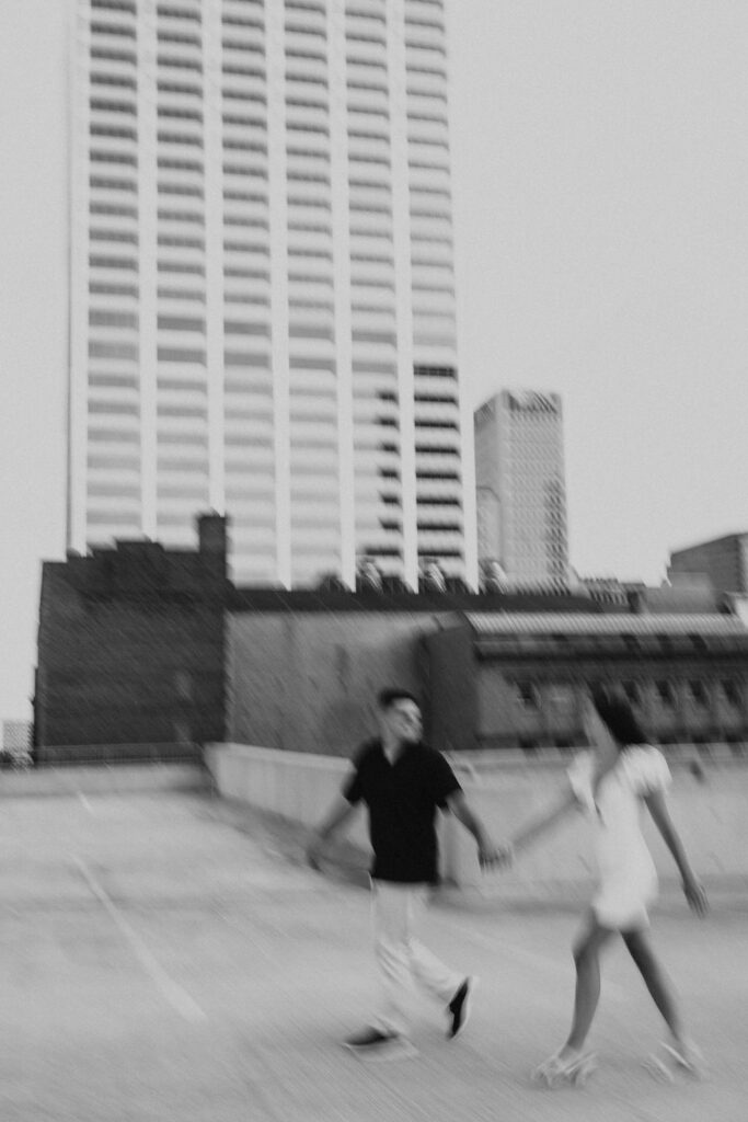 couple walks across the street in downtown columbus ohio