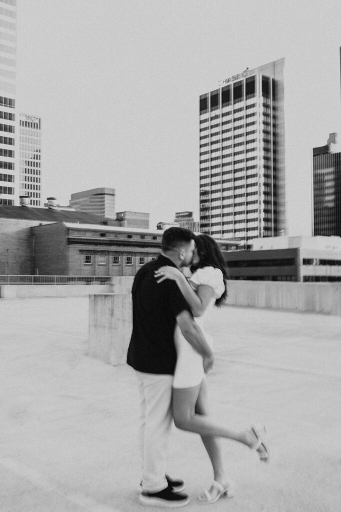 couple kiss on rooftop parking garage in downtown columbus ohio