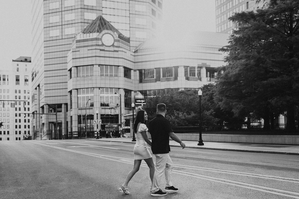 couple walks across the street in downtown columbus ohio