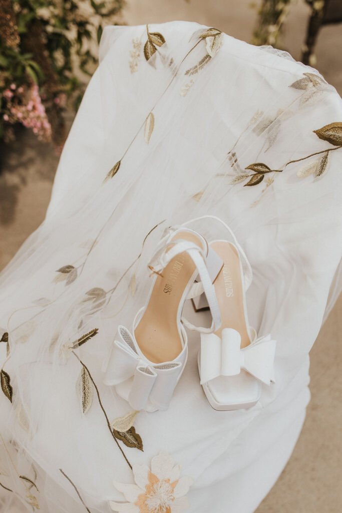 wedding details of bride's dress and shoes