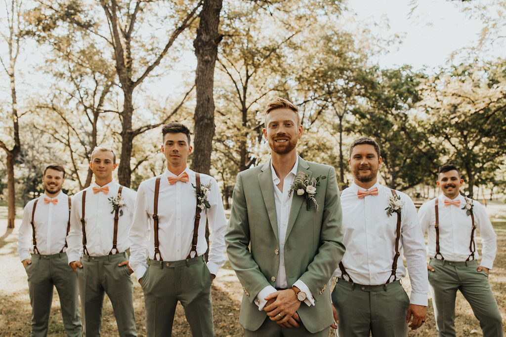 groom and groomsmen pose together