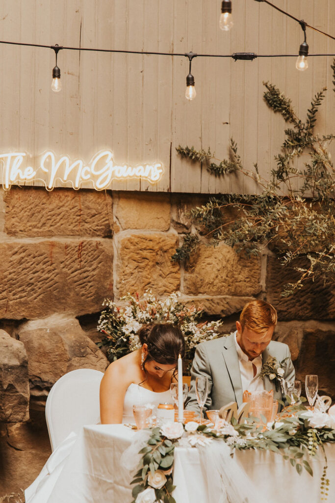 couple pray during reception