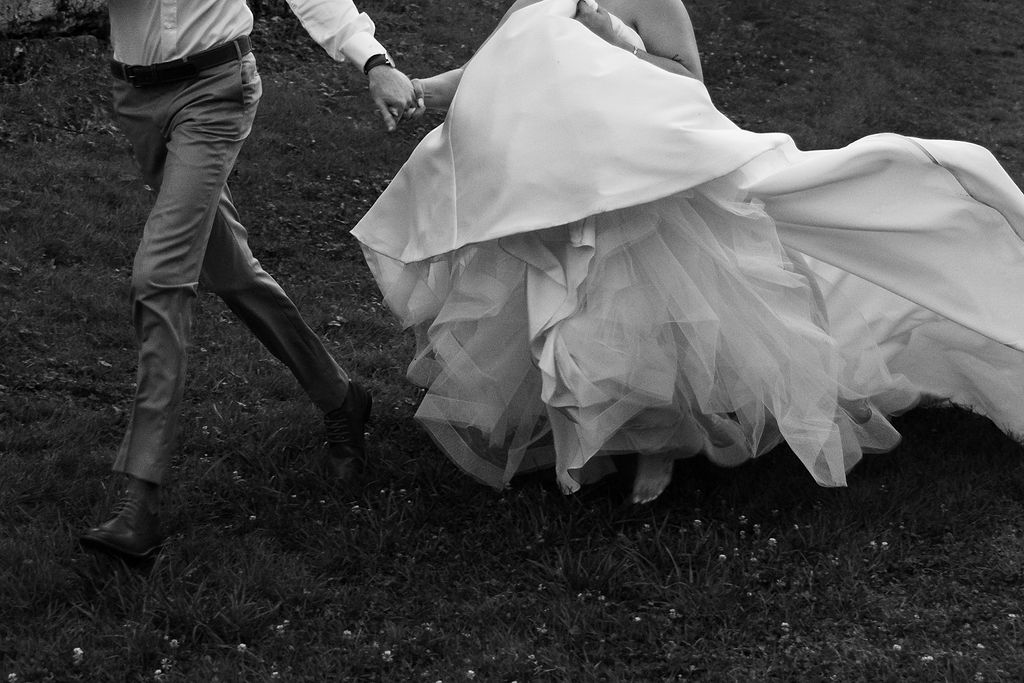 couple walking along grassy landscape