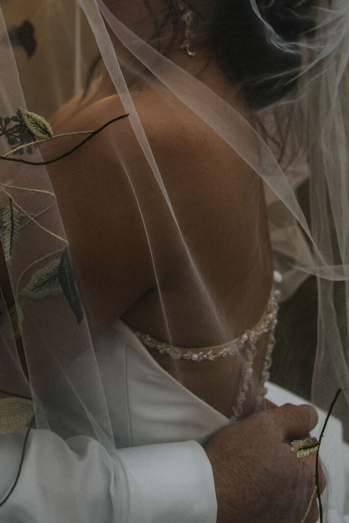 details of the bride's dress and veil