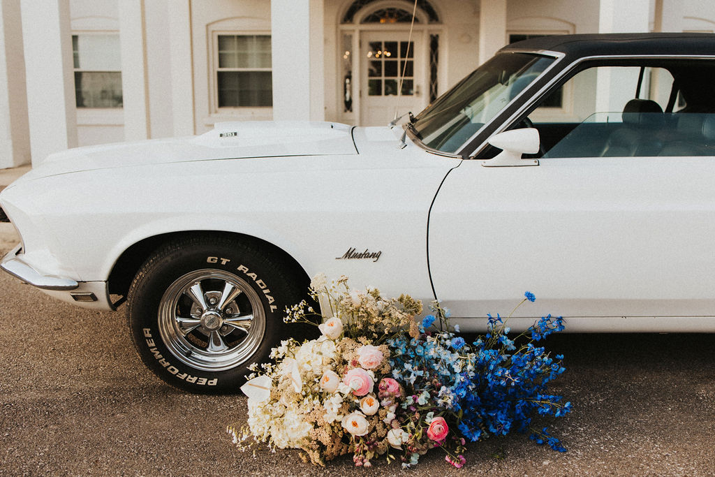 classic car with wedding flowers