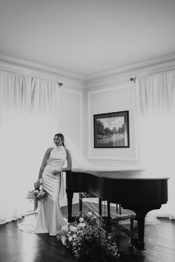 bridal portrait while posing with piano