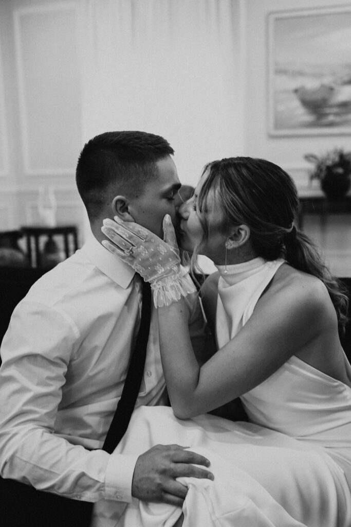 couple kiss on couch in the Westbrook Country club