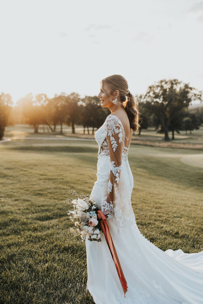 bridal portraits on golf course greens during sunset